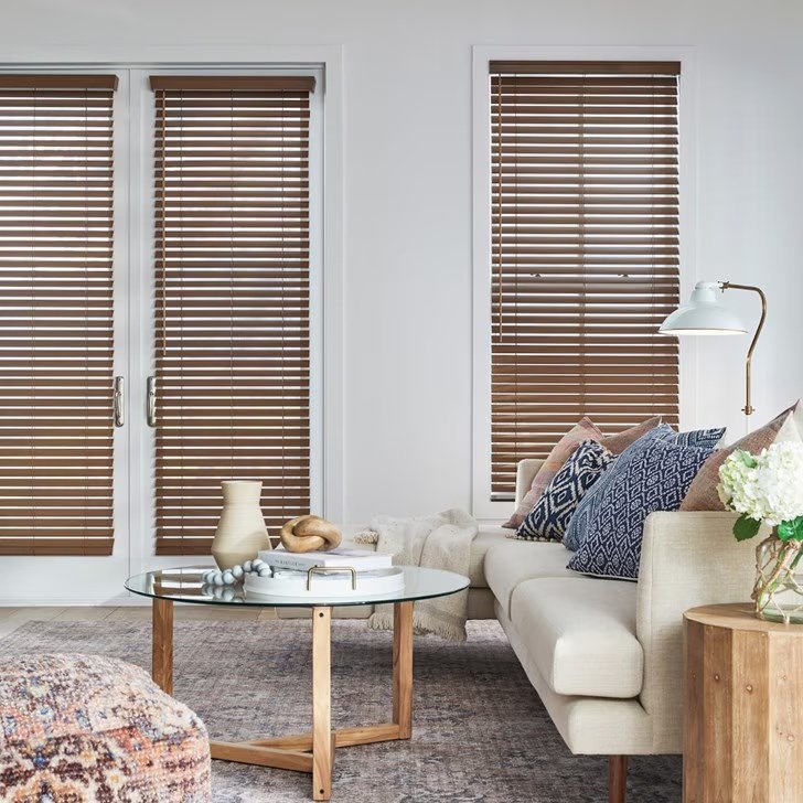 Close view of white faux wood blinds