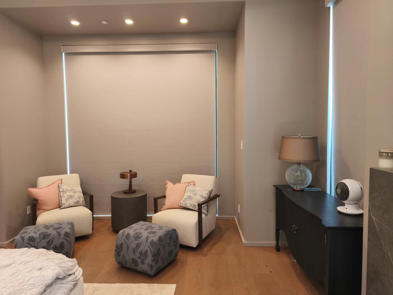 Custom roller shade installed in a bedroom sitting area