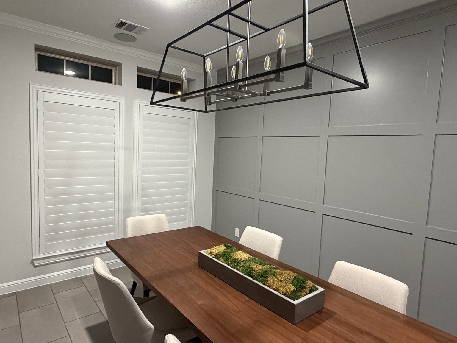 White plantation shutters installed in a dining room